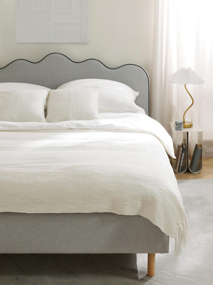 Romina Upholstered Bed with Wavy Headboard