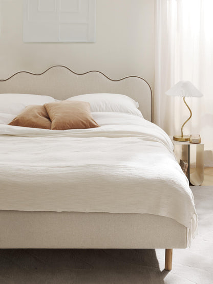 Romina Upholstered Bed with Wavy Headboard